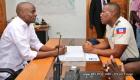 Haiti President Jovenel Moise speaking to  Petionville police Commissioner Monelus Gospel